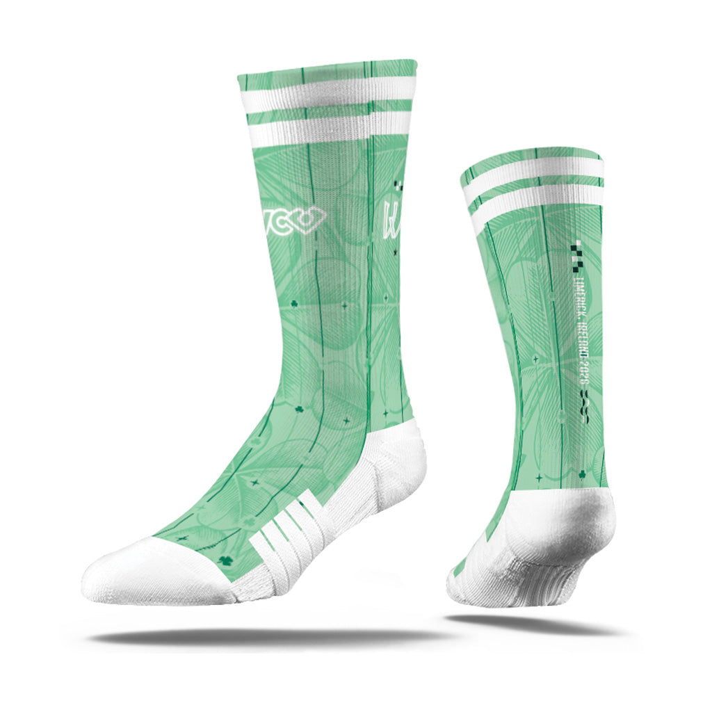 A pair of VC Ultimate mint green and white athletic WUCC 2026 crew socks shown from two angles (front and side).